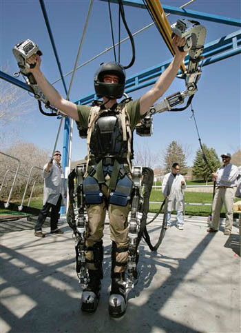 Software engineer Rex Jameson stretches in a robotic soldier suit being made for
the U.S. Army by Raytheon on Monday, April 14, 2008, in Salt Lake City. The suit
can multiply its wearer's strength and endurance as many as 20 times, with
relatively little loss of agility, by sensing and almost instantly amplifying... Software engineer Rex Jameson stretches in a robotic soldier suit being made for
the U.S. Army by Raytheon on Monday, April 14, 2008, in Salt Lake City. The suit
can multiply its wearer's strength and endurance as many as 20 times, with
relatively little loss of agility, by sensing and almost instantly amplifying...